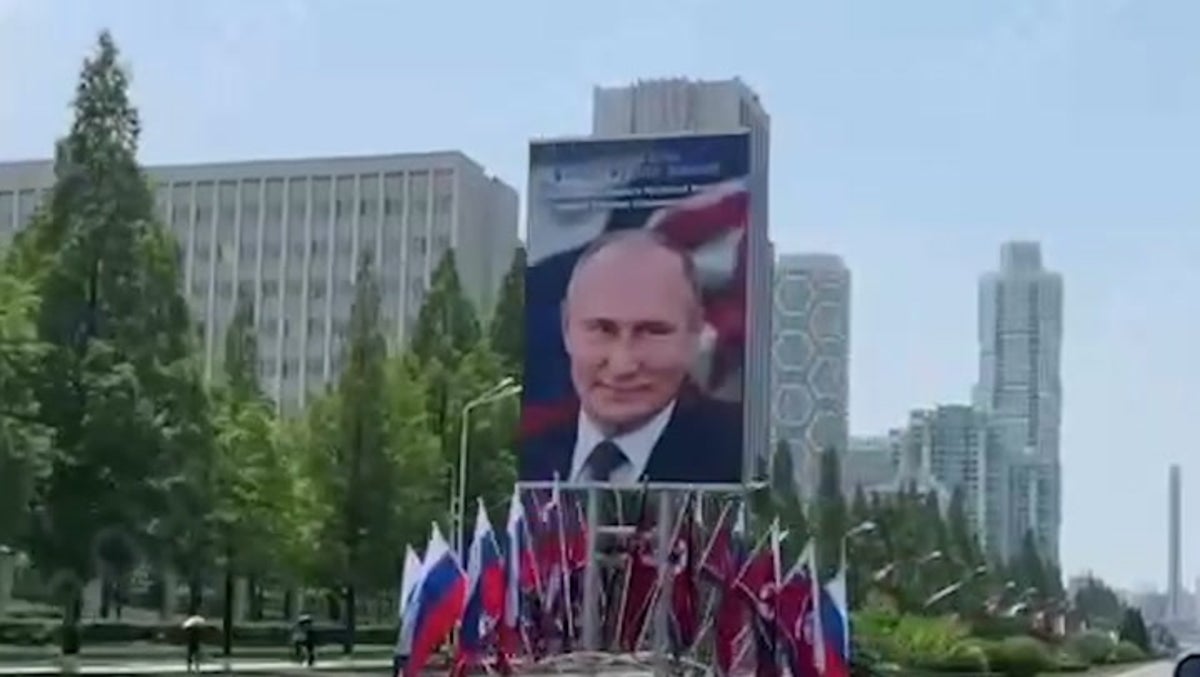 Portraits of Putin and Russian flags line streets in Pyongyang ahead of president’s visit