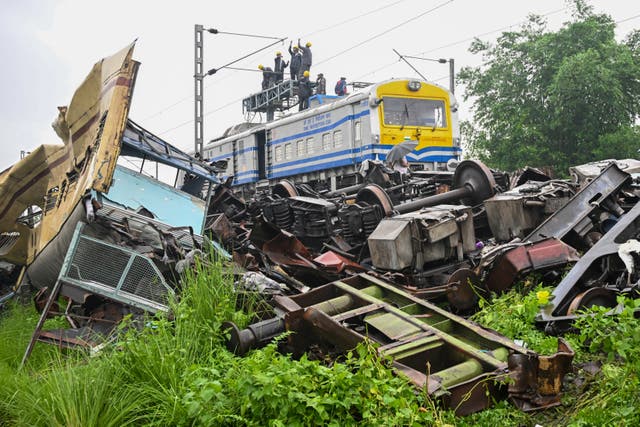 <p>Railway engineers inspect the accident site of the Kanchenjunga Express at Rangapani in West Bengal, India </p>