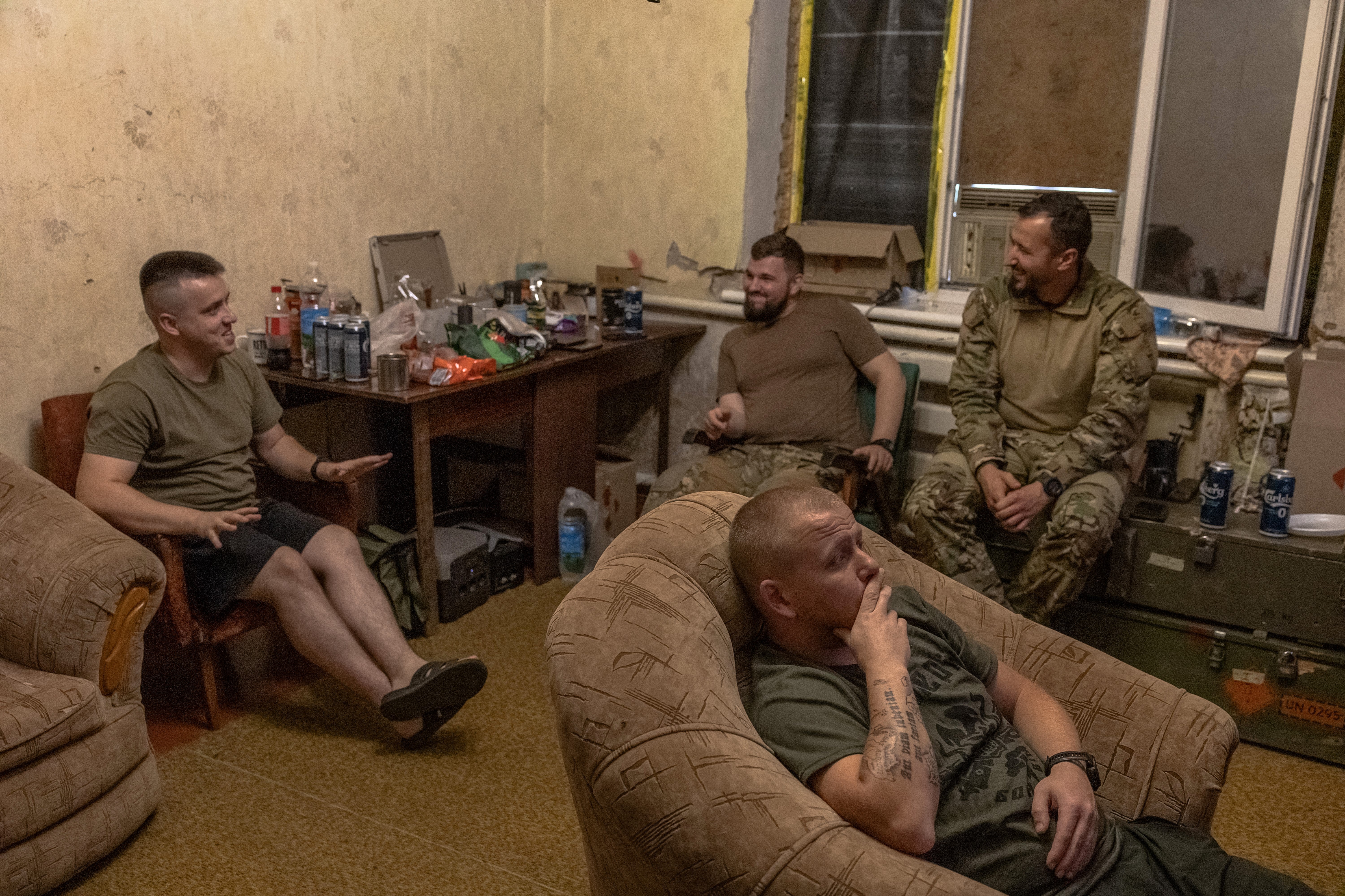 Ukrainian servicemen of the 80th Separate Galician Air Assault Brigade watch the UEFA Euro 2024 football match between Romania and Ukraine, in a house converted to a military base, in the Donetsk region