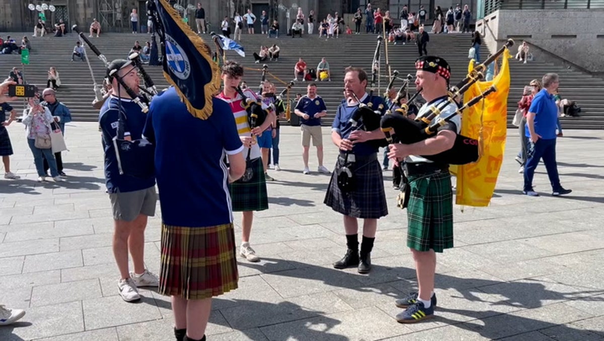 Scotland fans play bagpipes outside Cologne Cathedral ahead of crunch Euro 2024 match