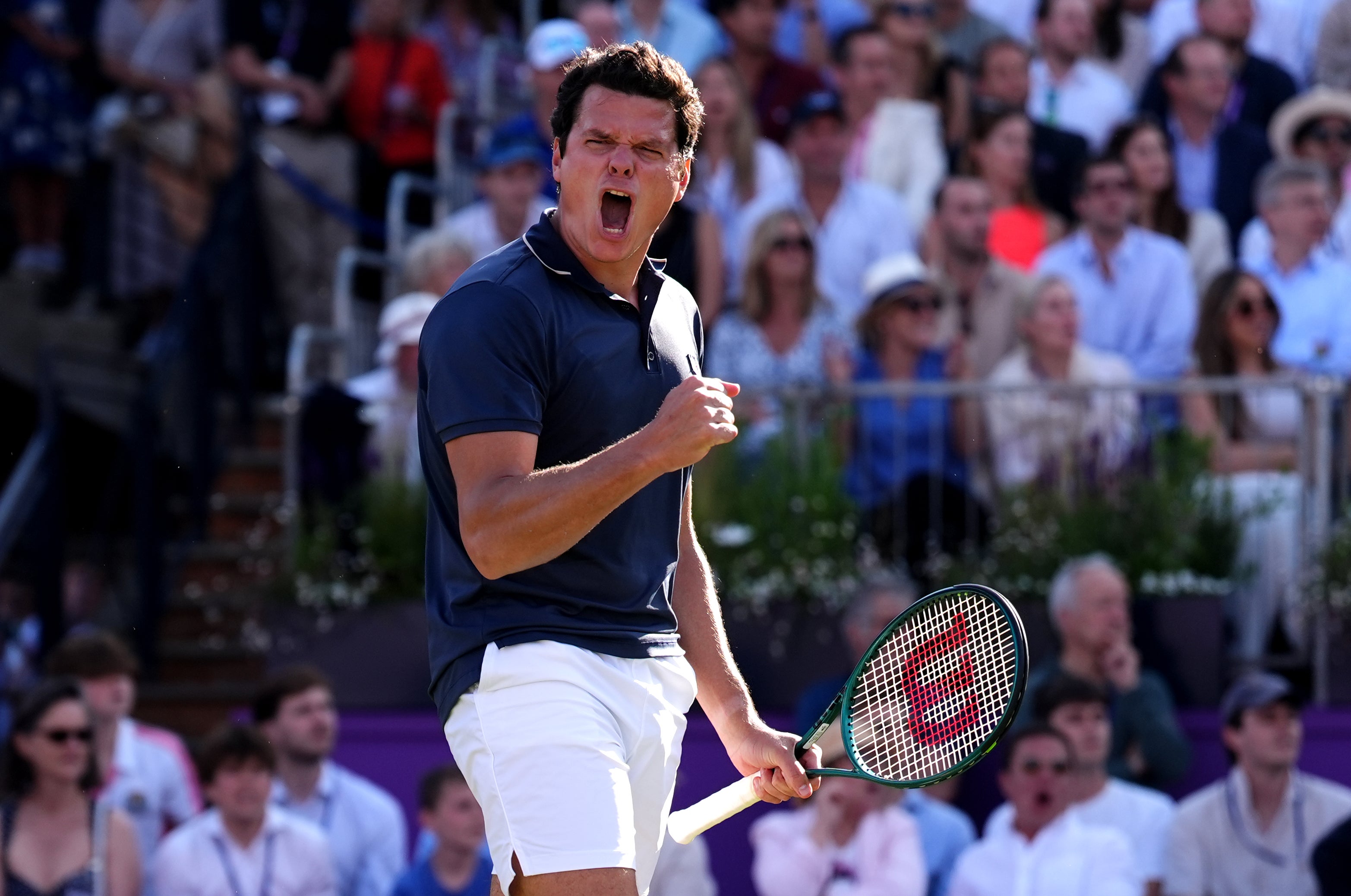 Milos Raonic celebrates victory over Cameron Norrie