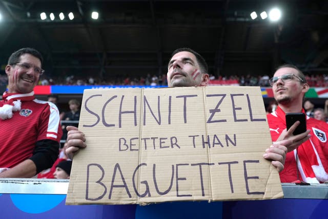 <p>Austrian fans taunt French fans ahead of their Group D match on Monday </p>