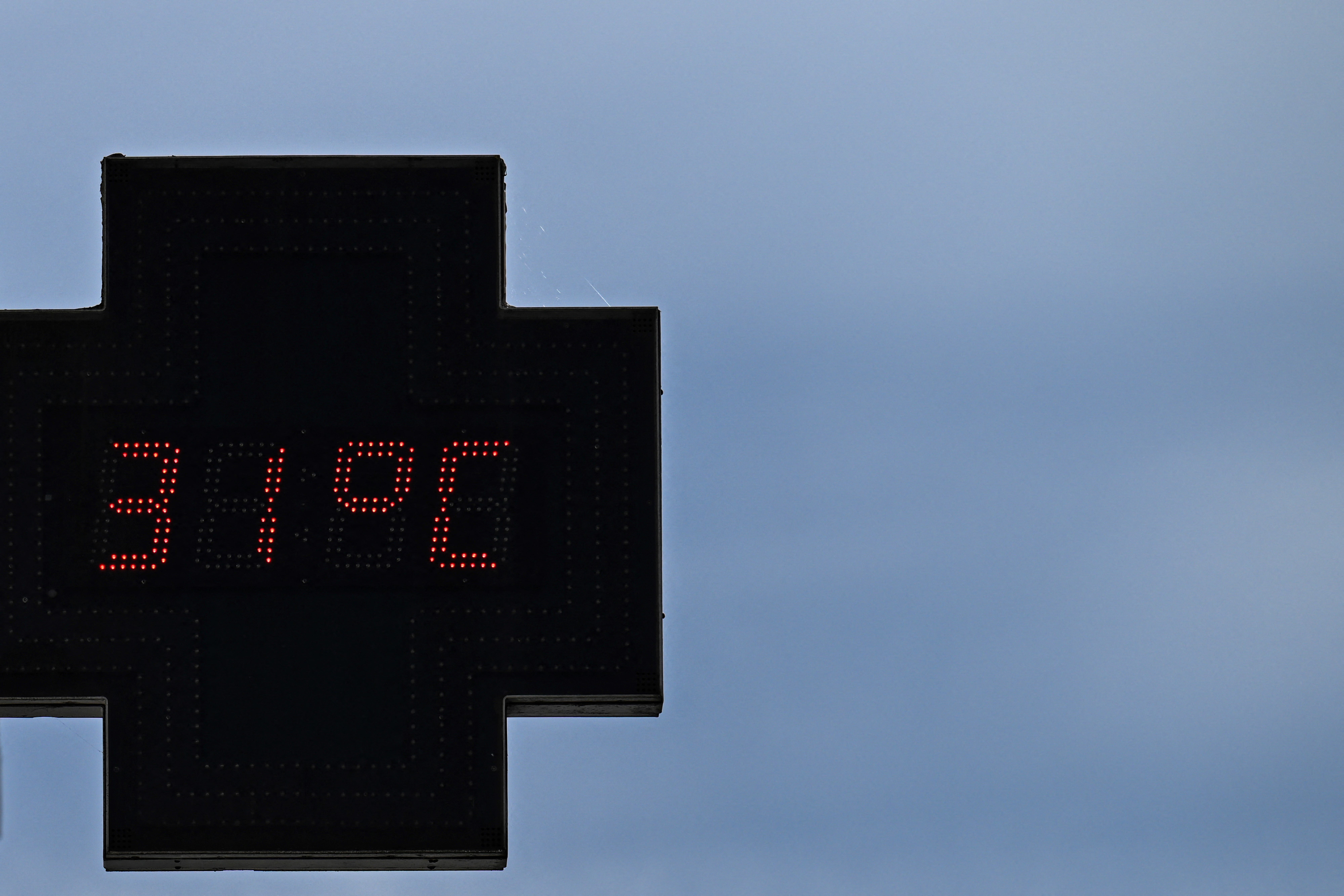 A pharmacy sign displaying the temperature 31C in Bordeaux, south-western France in April
