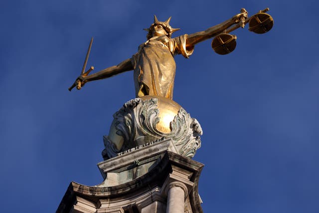 Pomeroy’s Statue of Justice stands on top of the Central Criminal Court building, Old Bailey (Jonathan Brady/PA)