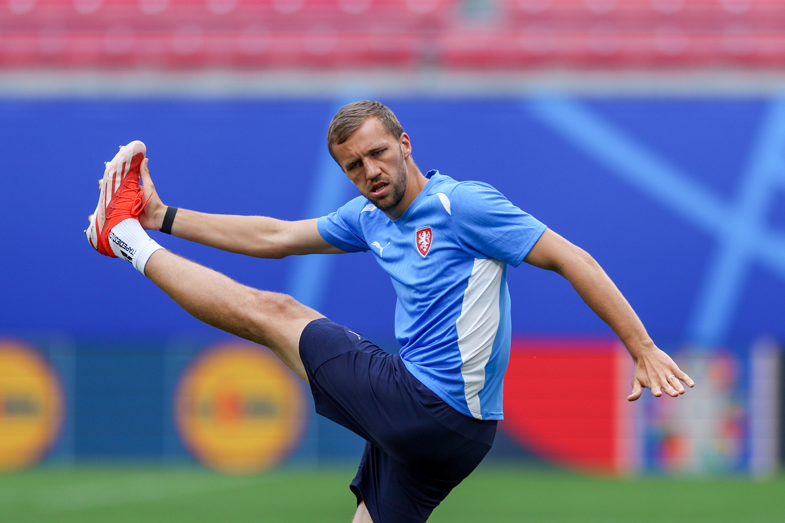 Czechia’s star midfielder Tomas Soucek stretches in training