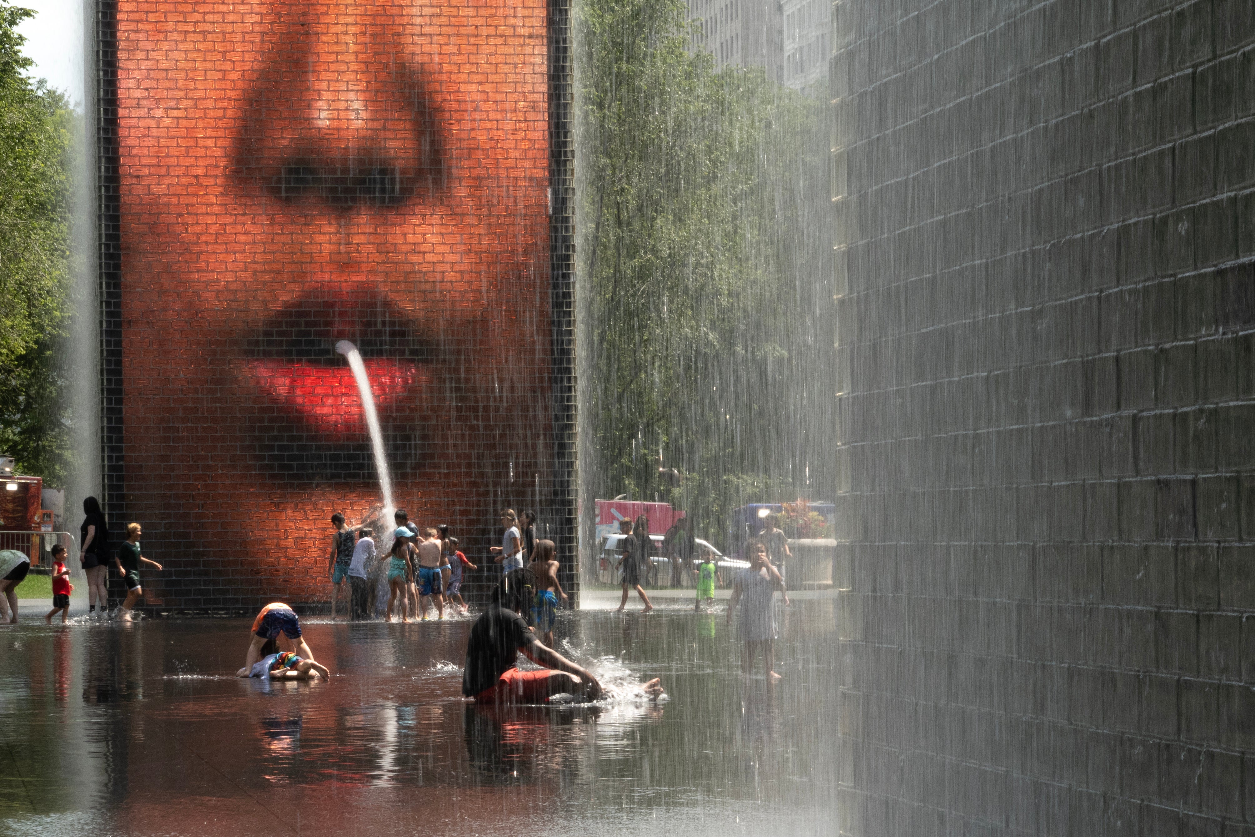 People cool off at Crown Fountain in Millennium Park as temperatures reached a record high of 97 degrees Fahrenheit on June 17, 2024 in Chicago, Illinois. Temperatures in the city are expected to reach highs in the 90s for the remainder of the week