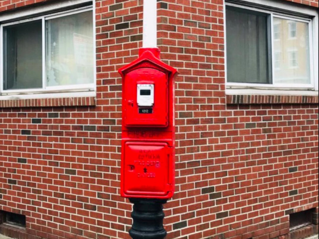 A red firebox in Boston. After 911 services went down across Massachusetts on Tuesday, the Boston Fire Department advised residents to use the boxes to alert firefighters to emergencies