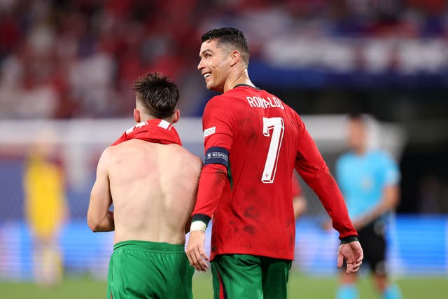 <p>Cristiano Ronaldo celebrates with match-winner Francisco Conceicao</p>