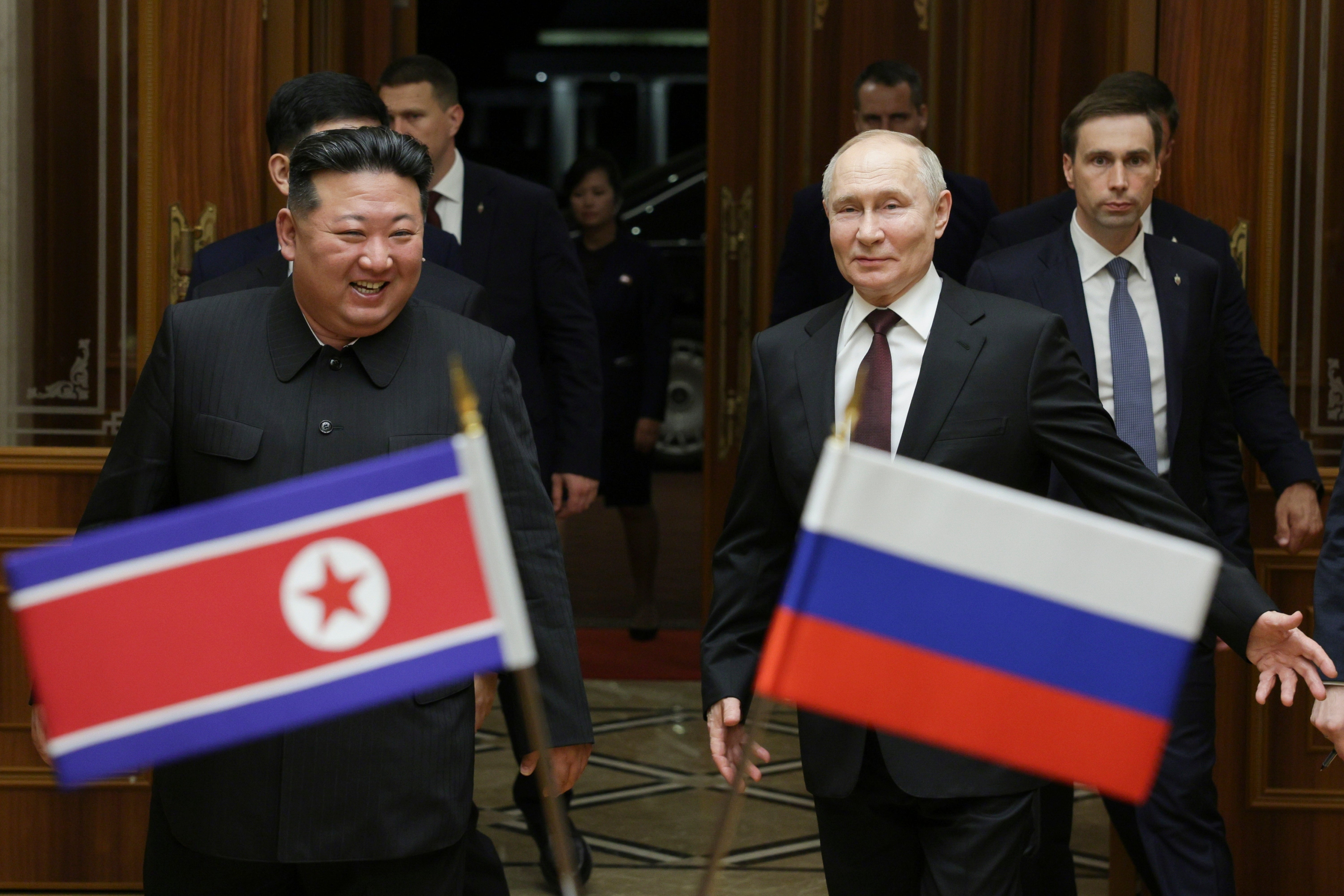 Russian President Vladimir Putin, right, and North Korea's leader Kim Jong Un smile during their meeting at the Pyongyang Sunan International Airport outside Pyongyang, North Korea, early Wednesday, 19 June 2024. (Gavriil Grigorov, Sputnik, Kremlin Pool Photo via AP)