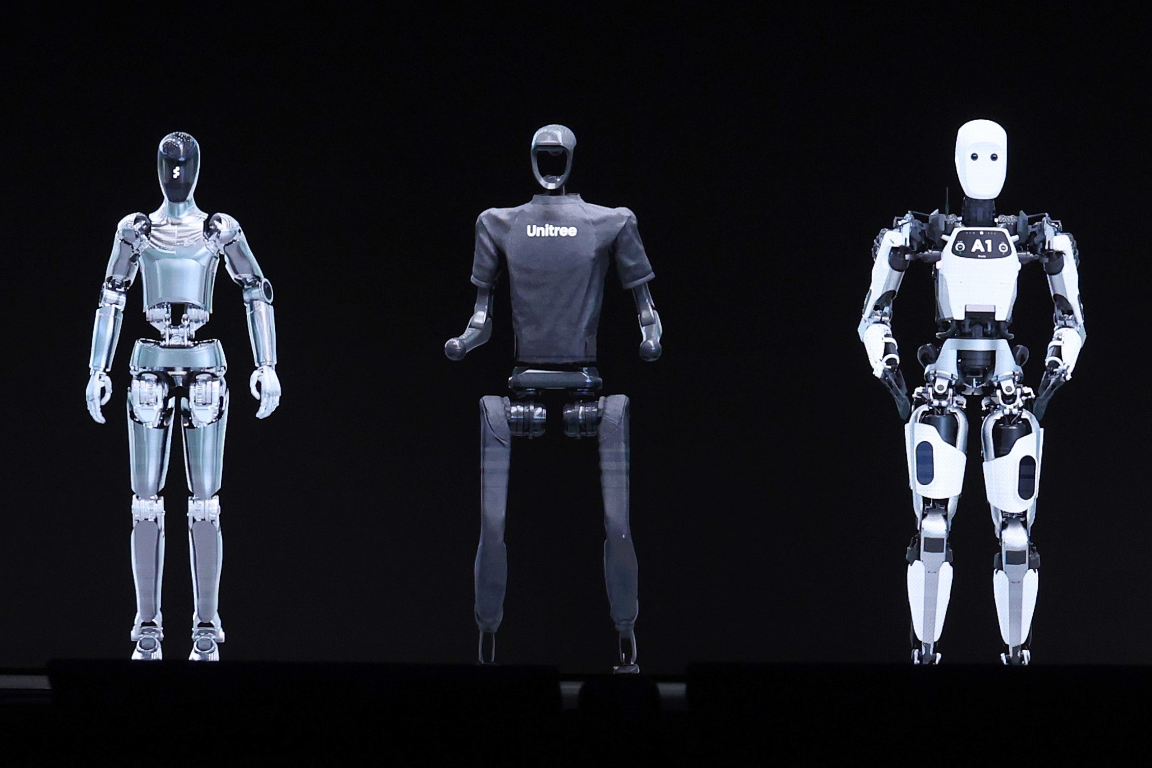 AI robots pictured on stage at a keynote address during the Nvidia GTC Artificial Intelligence Conference on 18 March, 2024 in San Jose, California