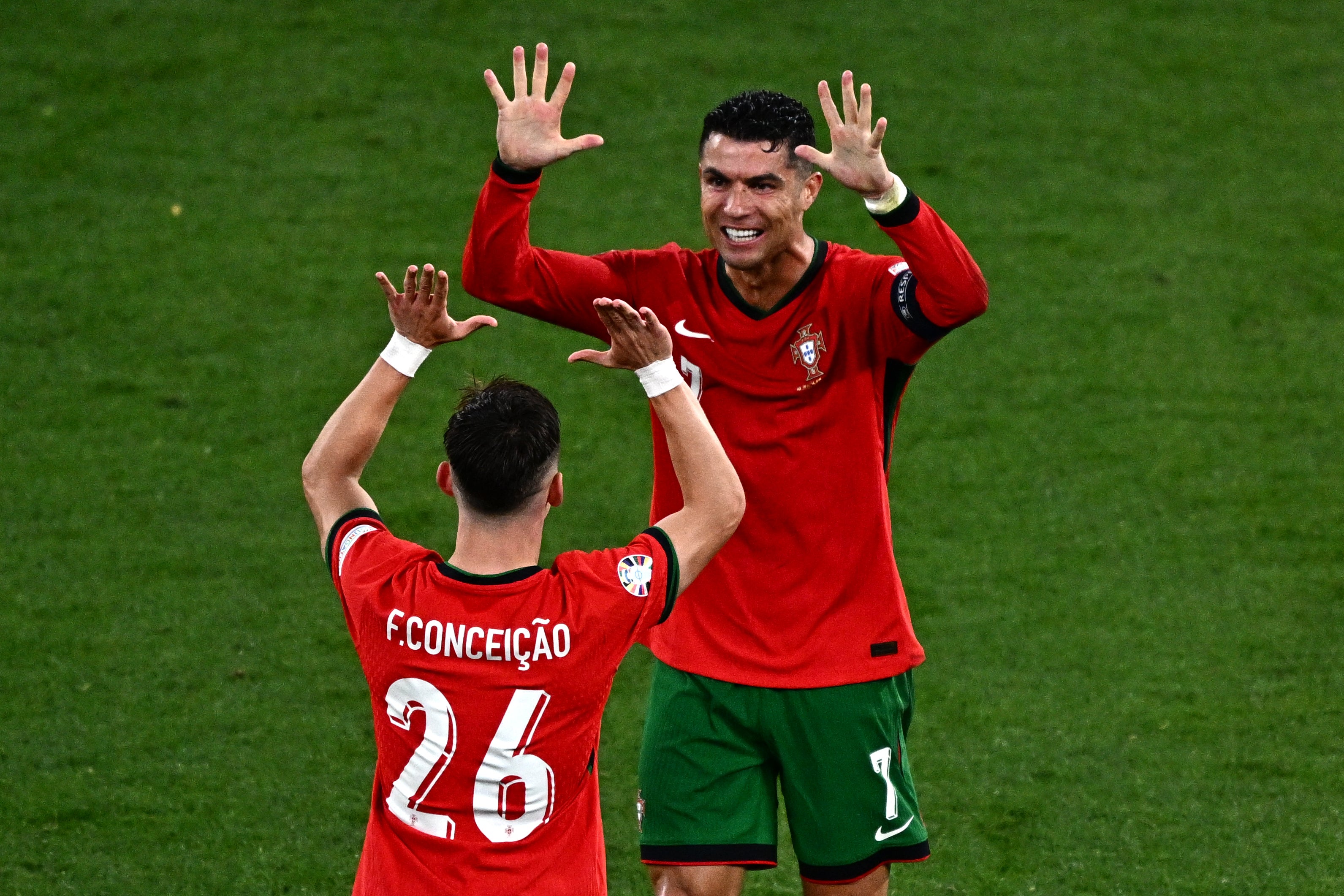 Ronaldo celebrates with match-winner Conceicao