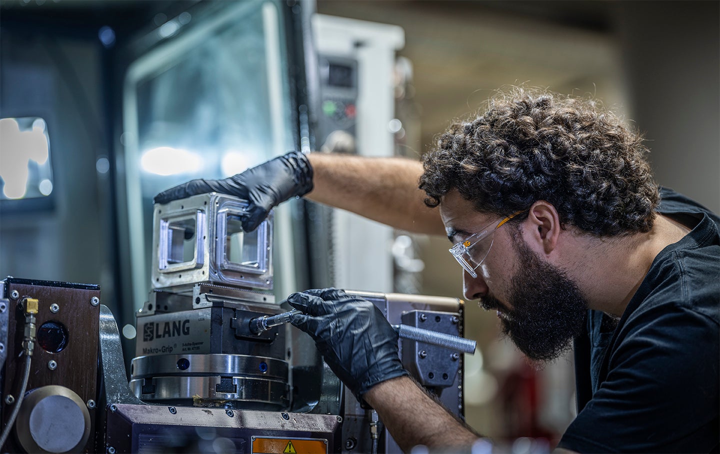 Working in the CNC shop at the Autodesk Boston Technology Center in Boston, Massachusetts. Autodesk Researcher, Zack Tenaglia, uses a CNC machine