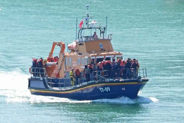 The Home Office said 882 people arrived in the UK after crossing the Channel on small boats on Tuesday (PA)