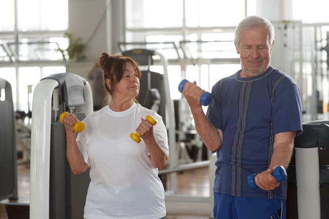 A physiotherapist and personal trainer both encourage seniors to get into weight training (Alamy/PA)