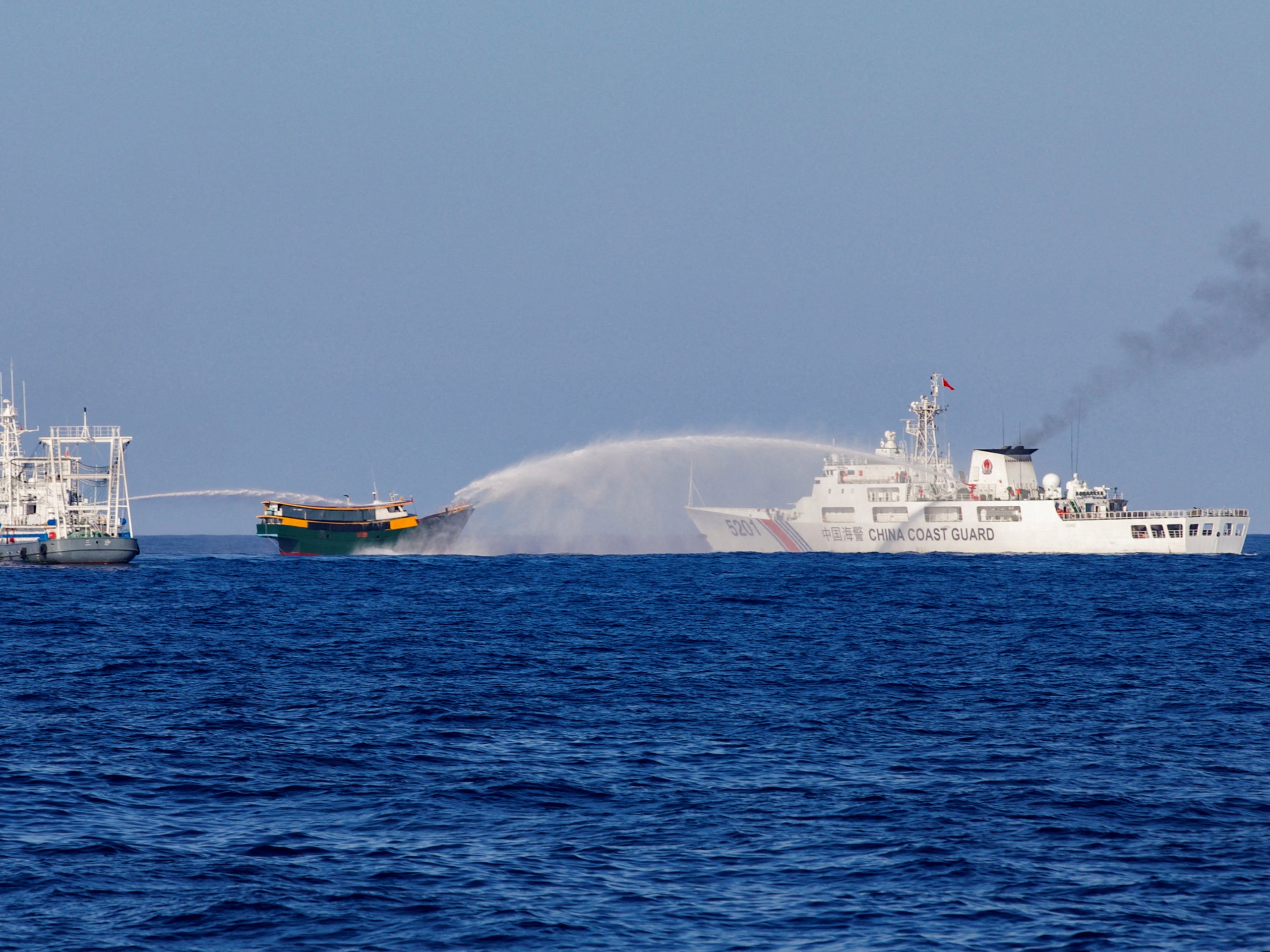 <p>File. Chinese Coast Guard vessels fire water cannons towards a Philippine resupply vessel Unaizah on its way to a resupply mission at Second Thomas Shoal in the South China Sea</p>