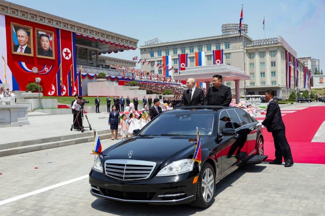 <p>Russian President Vladimir Putin, left, and North Korea's leader Kim Jong Un, right, arrive to attend the official welcome ceremony in the Kim Il Sung Square in Pyongyang</p>