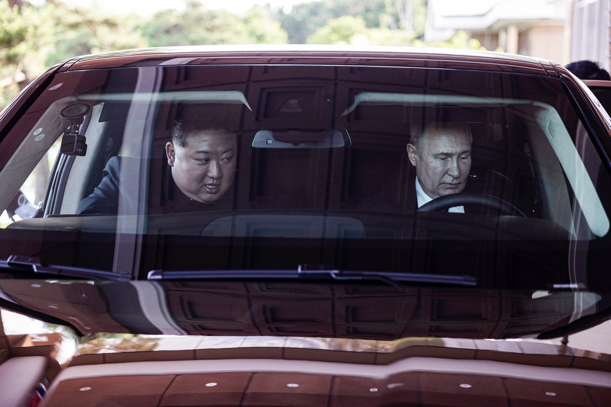 The two leaders ride in an Aurus car, a gift from Putin to his host