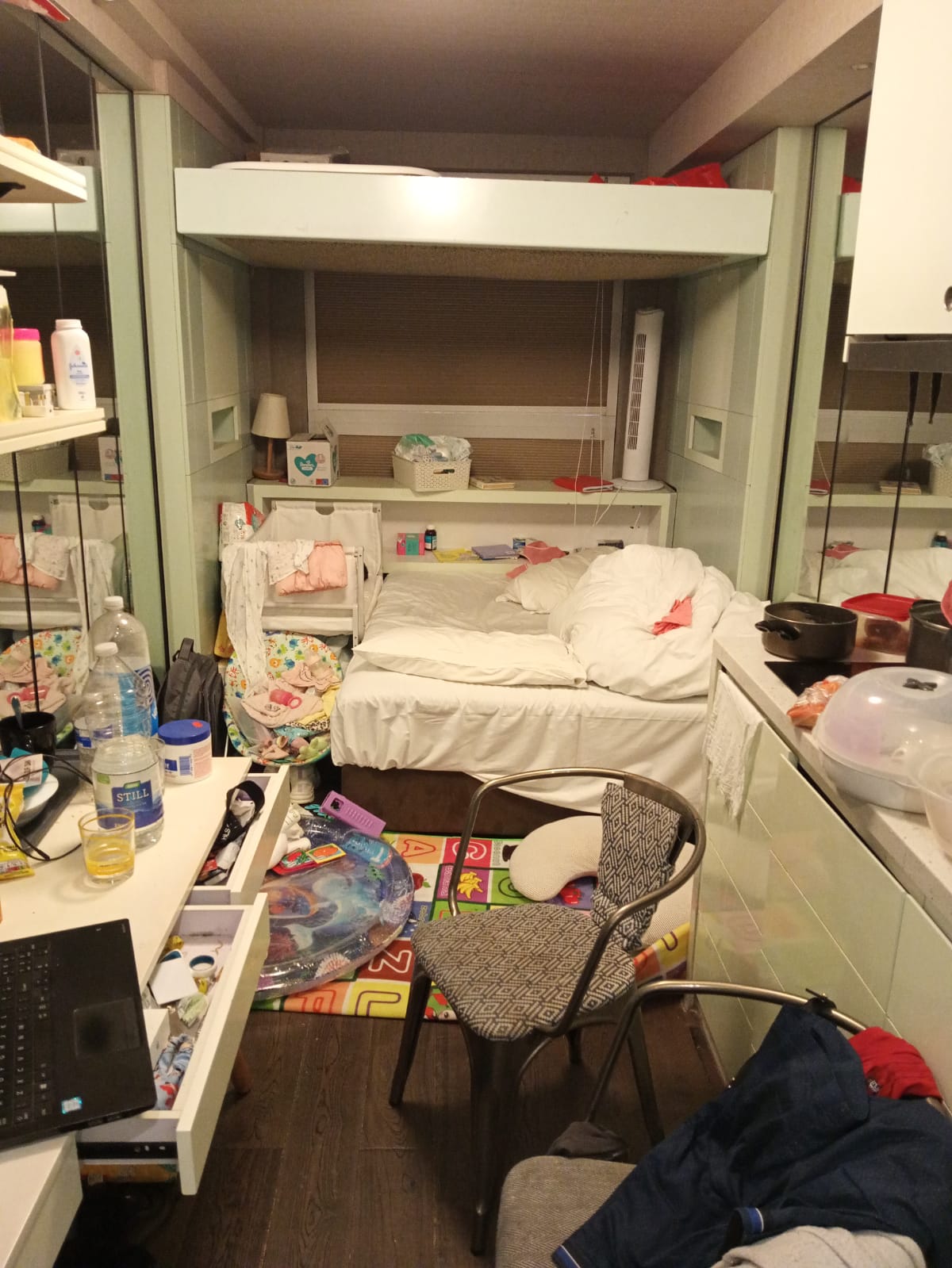 One family of three, two adults and their nine-month-old baby, have been living in this small cramped hotel room for almost a year