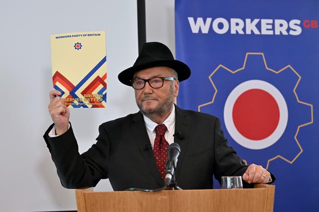 <p>Leader of the Workers Party of Britain George Galloway holds a copy of the manifesto during his party's manifesto launch on Wednesday </p>