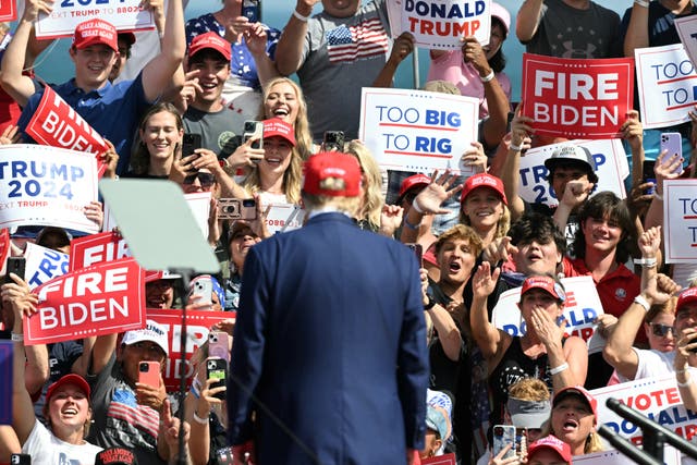 <p>Supporters of former US President and Republican presidential candidate Donald Trump cheer as he arrives to speak at a campaign event in Racine, Wisconsin. He is now saying that he always planned to stay in Wisconsin during the Republican National Convention and downplayed reports he was looking at a Chicago hotel during the event.  </p>