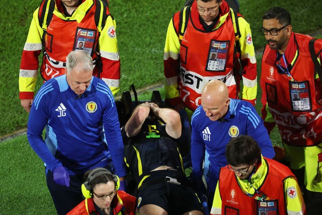<p>Tierney left on a stretcher during the 1-1 draw against Switzerland </p>