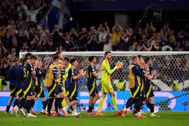 Scotland players applaud their supporters after a hard-fought point (Martin Rickett/PA)