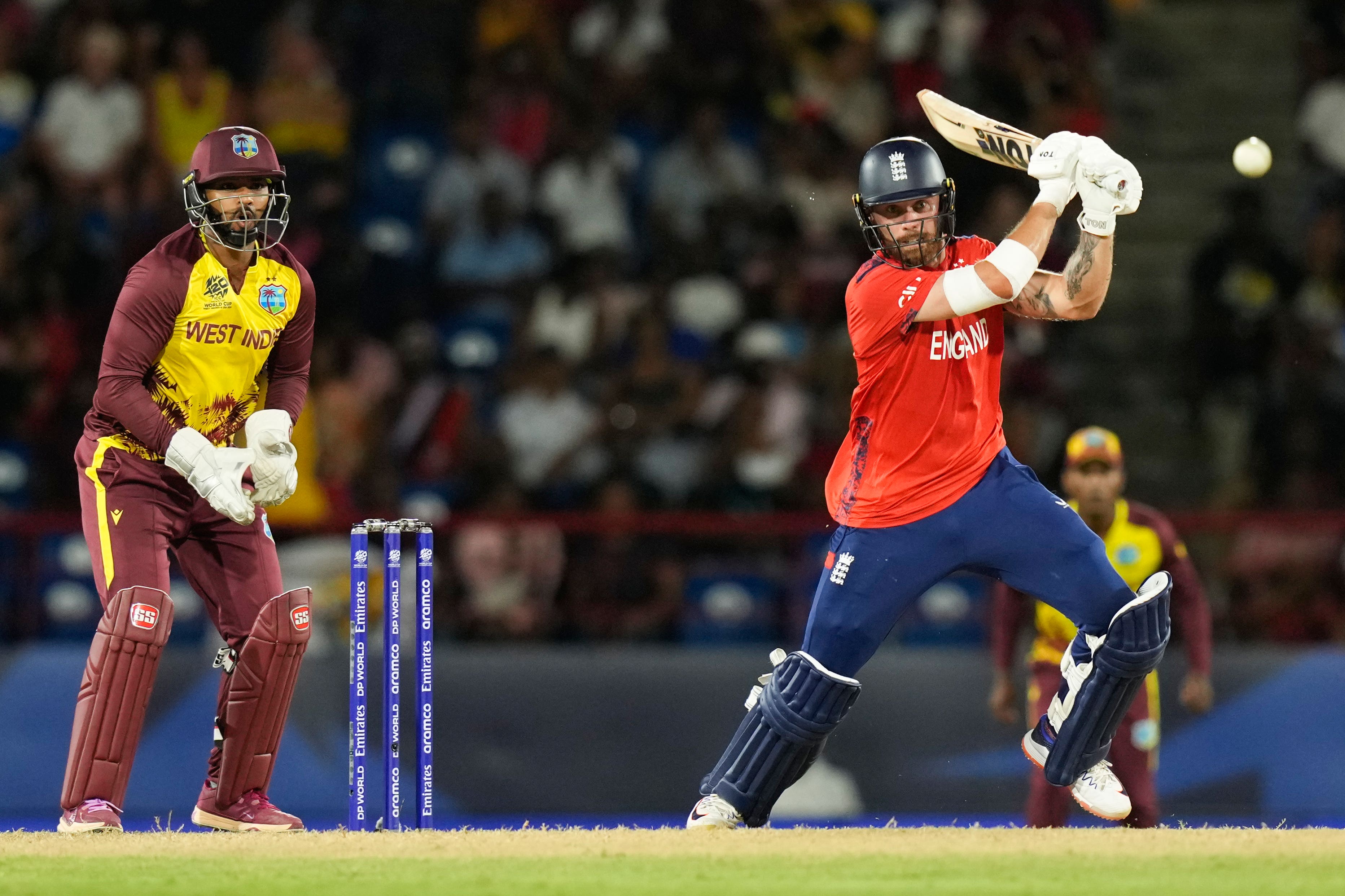 England’s Phil Salt, right, bats during the men’s T20 World Cup match against the West Indies (Ramon Espinosa/AP)