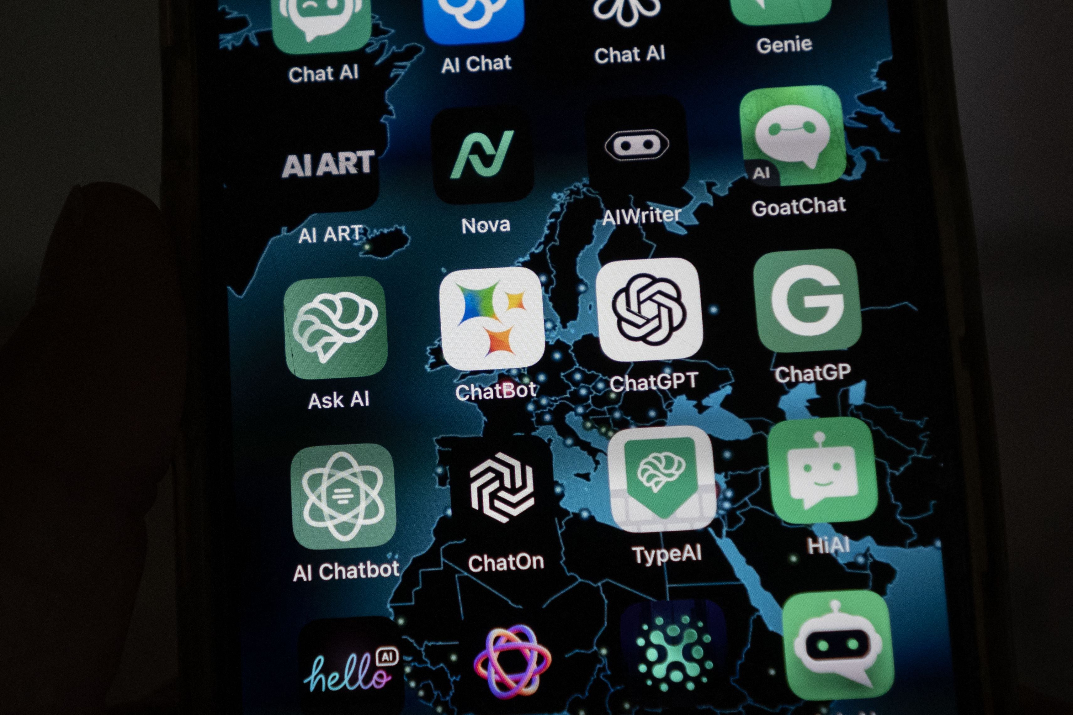 <p>This illustration picture shows icons of Google’s AI (Artificial Intelligence) app BardAI (or ChatBot) (C-L), OpenAI’s app ChatGPT (C-R) and other AI apps on a smartphone screen in Oslo, on July 12, 2023</p>
