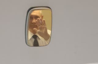 Vladimir Putin bids goodbye to his North Korean ally Kim Jong-un from his aircraft as he leaves for Vietnam