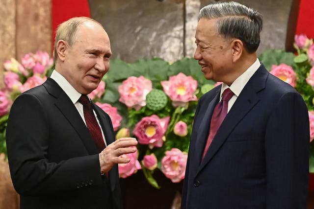 <p>Russia's President Vladimir Putin speaks to Vietnam's President To Lam during an official visit at the Presidential Palace in Hanoi</p>