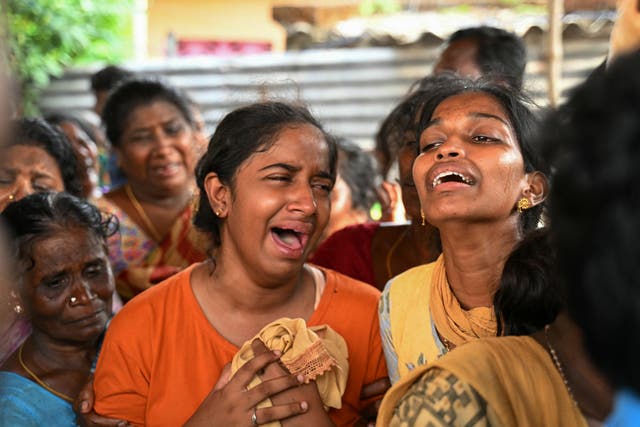 <p>Relatives mourn the people who died after consuming toxic illegal alcohol in Kallakurichi in India’s Tamil Nadu state on 20 June 2024</p>
