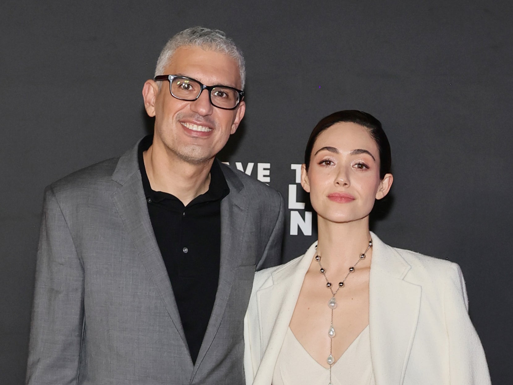 Sam Esmail and Emmy Rossum at the premiere of “Leave The World Behind” in December 2023