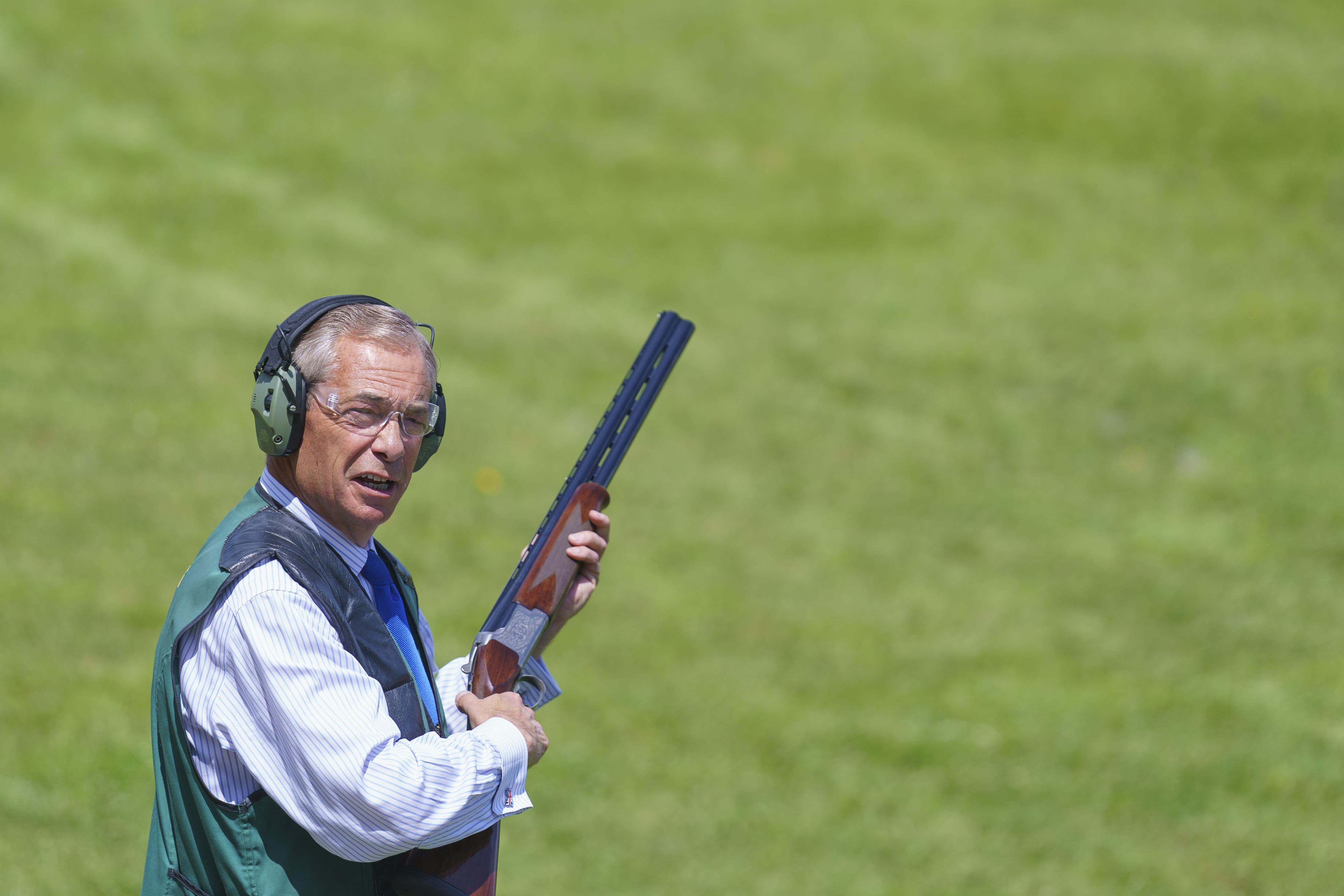 Reform UK leader Nigel Farage takes part in clay pigeon shooting during a visit to Catton Hall in Frodsham, Cheshire (Dominic Lipinski/PA)