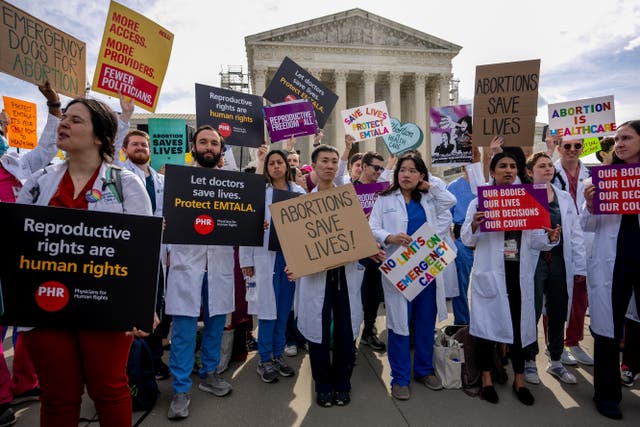 <p>A group of doctors join abortion rights supporters at a rally outside the Supreme Court on April 24, 2024 in Washington, DC</p>