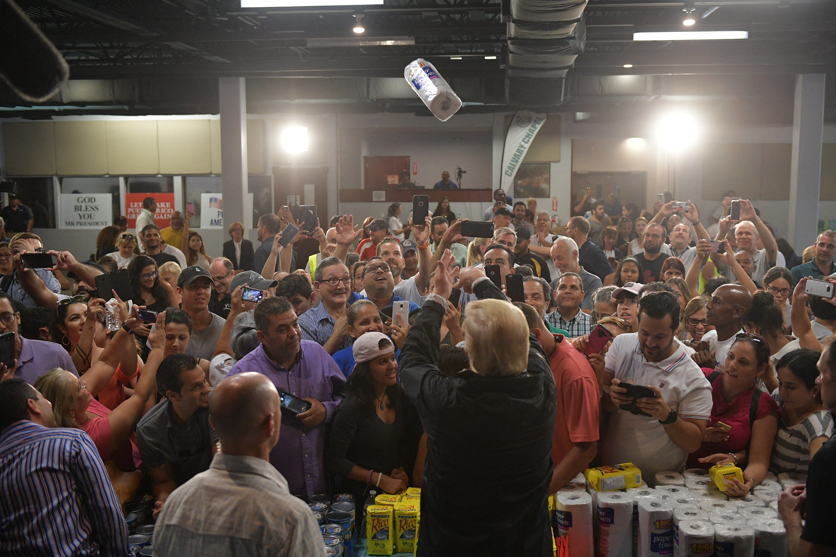 Trump threw rolls of paper towels into a crowd as he visited the Cavalry Chapel in Guaynabo, Puerto Rico on October 3, 2017