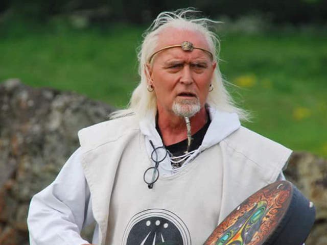 <p>Adrian Rooke performs a handfasting ritual</p>