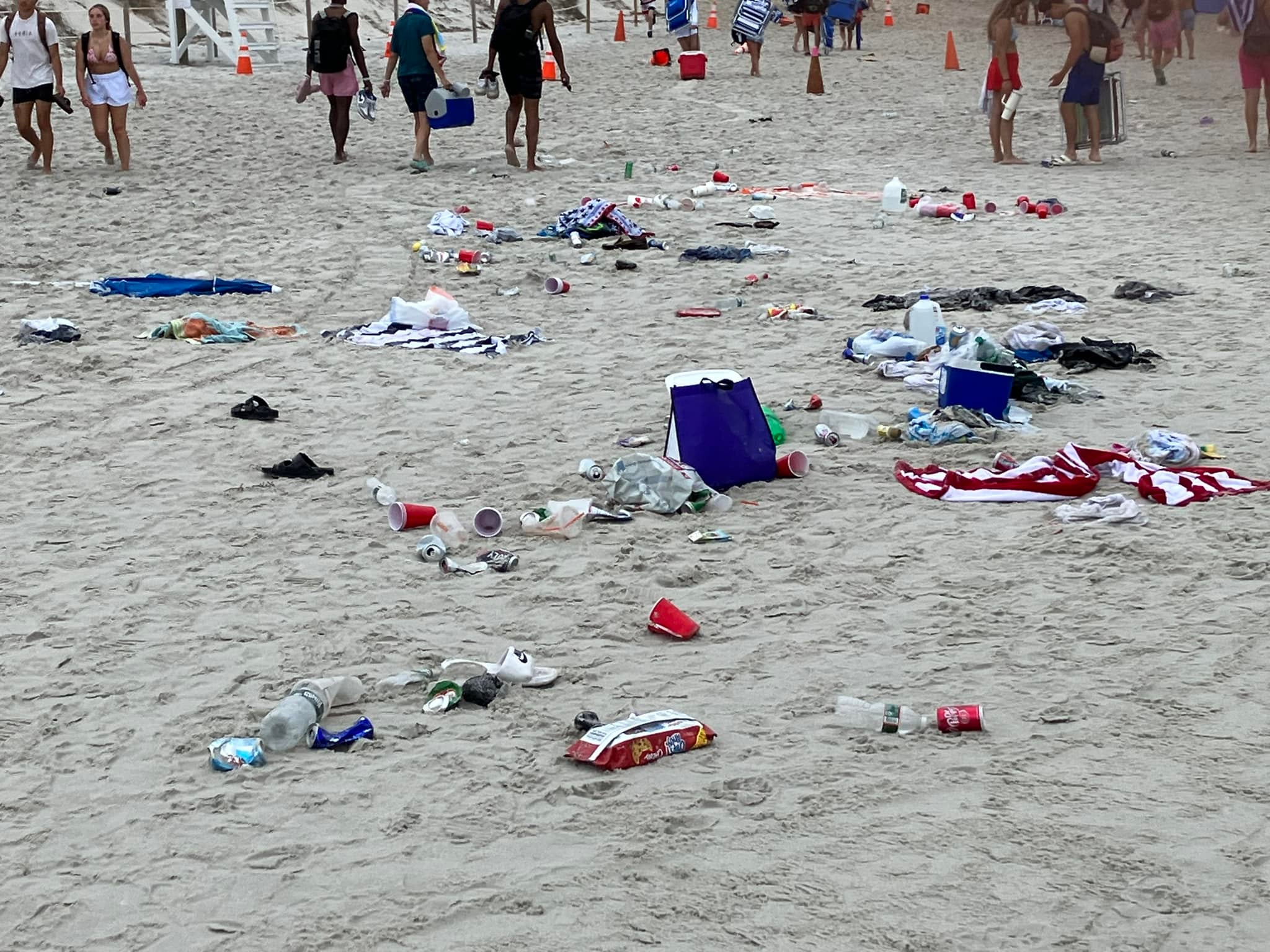 Trash left behind on July 4, 2023 on a beach in Dennis, Massachusetts. There will be no daily parking passes sold at Mayflower, Chapin, and Bayview beaches on the holiday this year, police say