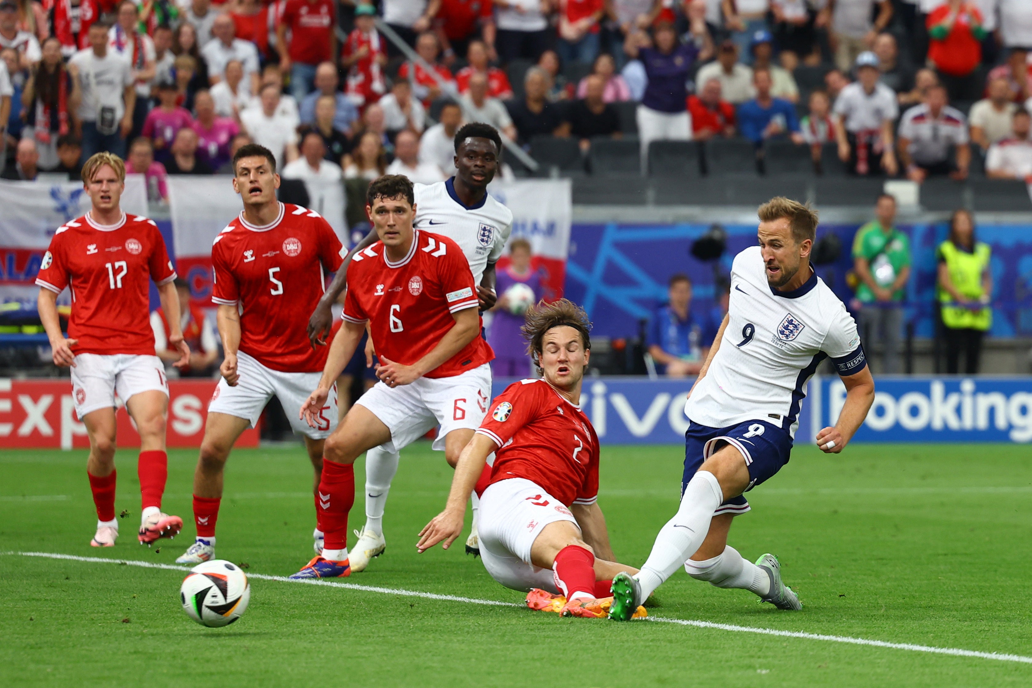 Kane pounces on the loose ball inside the box.