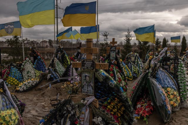 <p>The graves of Ukrainian soldiers killed during the Russian invasion of Bucha, a suburb of Kyiv </p>