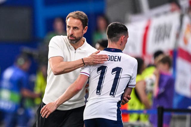 <p>Gareth Southgate embraces Phil Foden after replacing the winger</p>