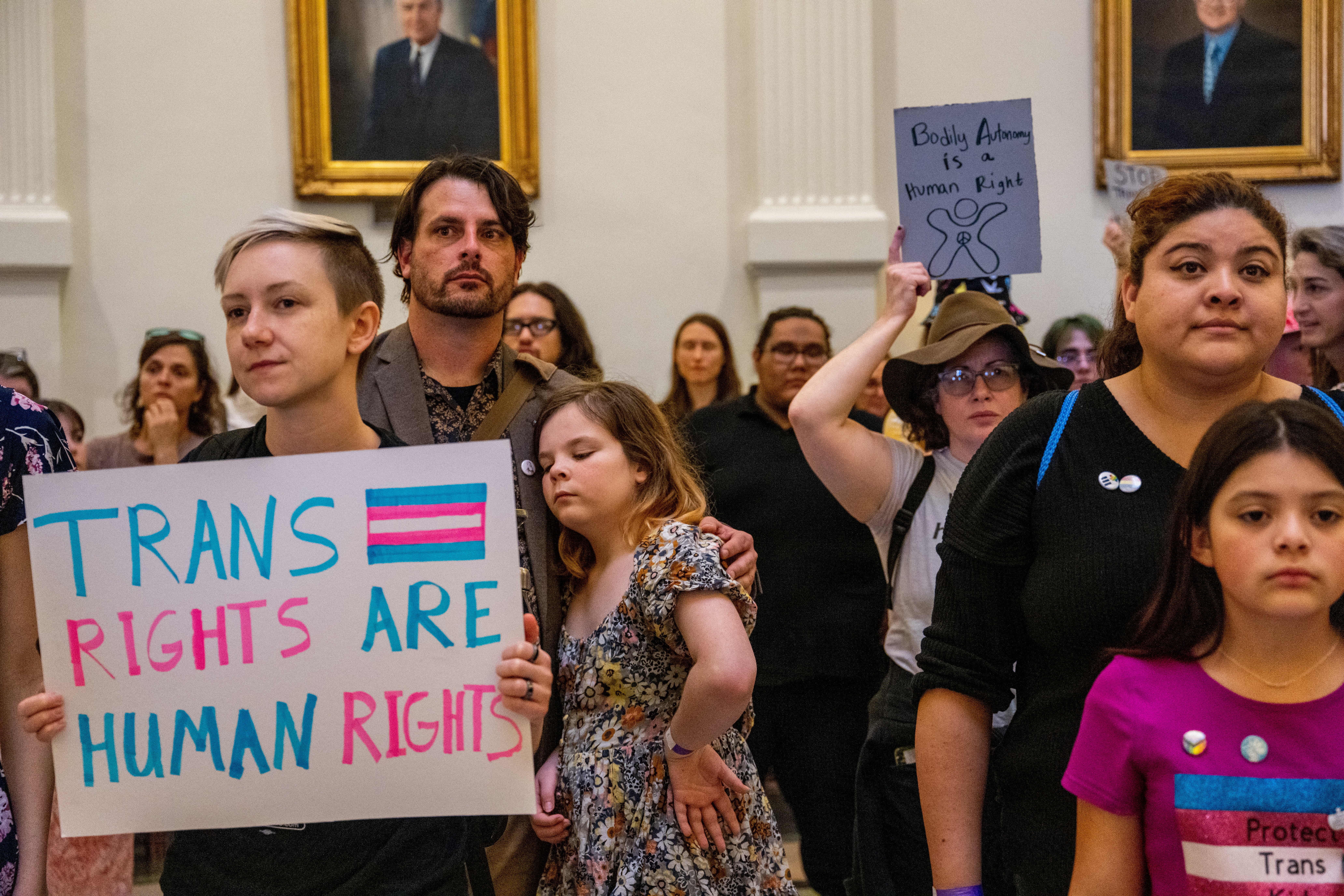 Transgender rights demonstrators protest inside the Texas state capitol in 2023.