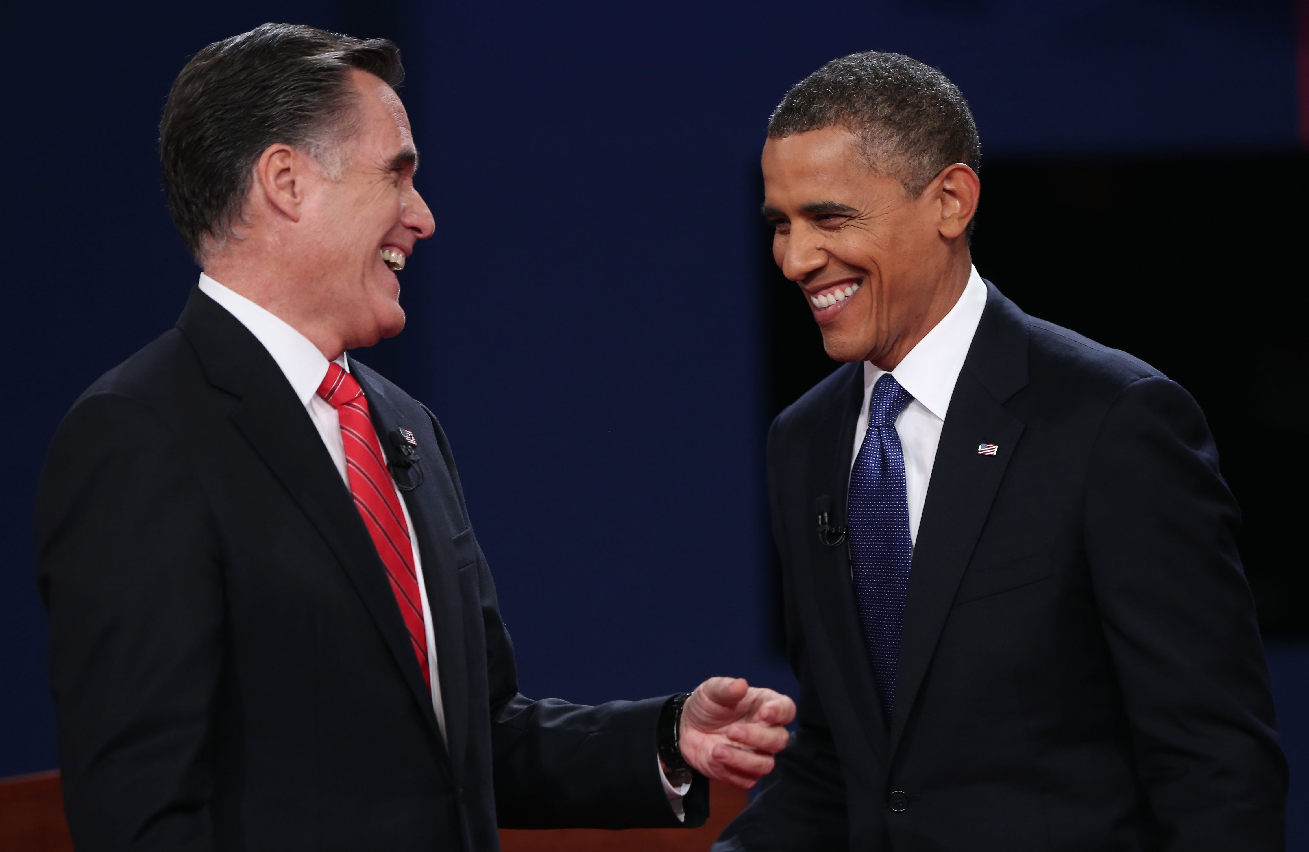 Obama and Romney smile after their first debate on October 3, 2012 in Denver, Colorado