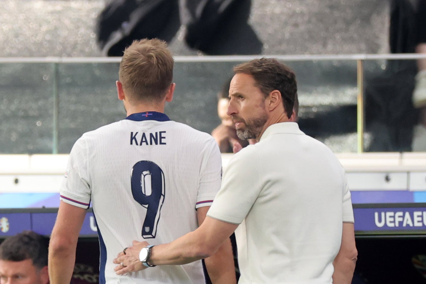 Gareth Southgate (right) talks to Harry Kane after removing the England captain