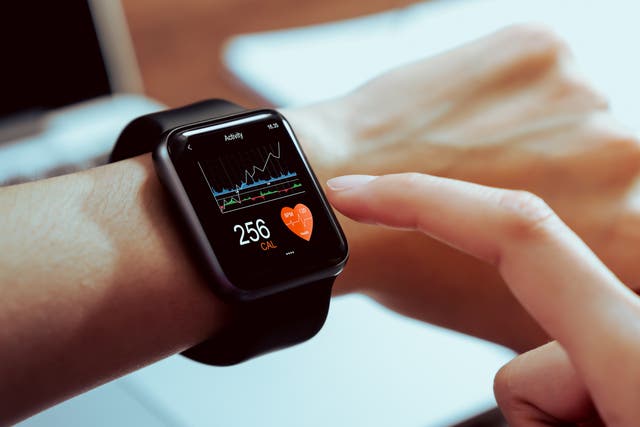 <p>Close up of hand touching smartwatch with health app on the screen (<em>Getty Images</em>)</p>