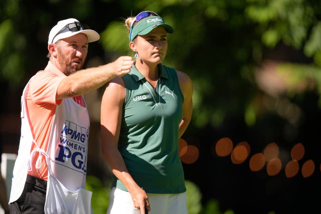 Lexi Thompson talks with her caddie on the 12th tee (Gerald Herbert/AP)