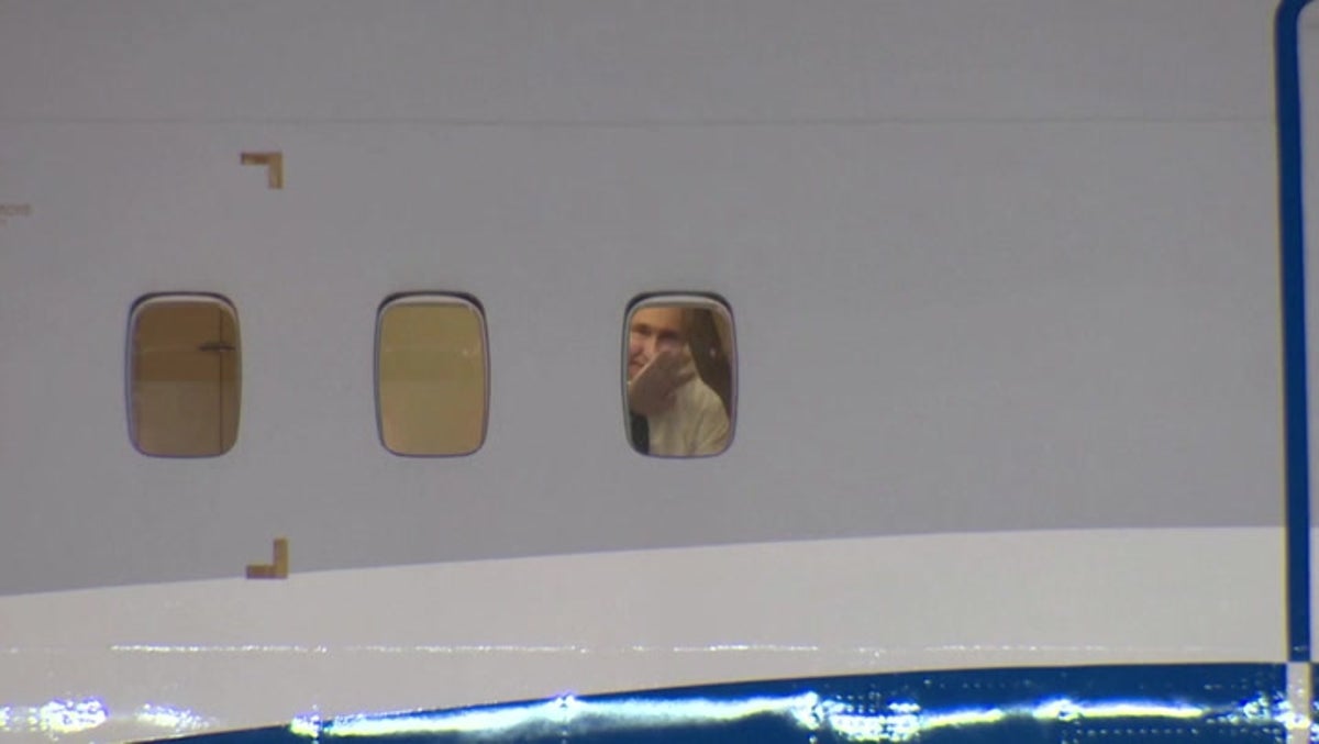 Putin waves goodbye to Kim Jong-un through window of private jet as he departs North Korea