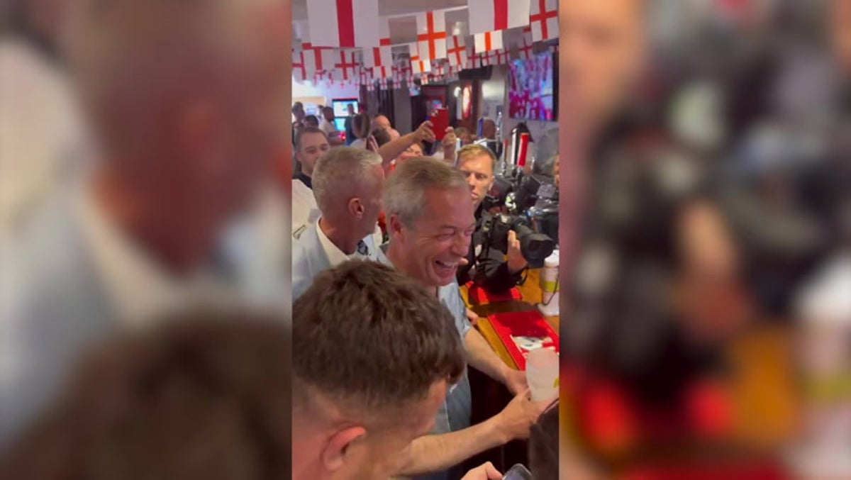 Nigel Farage and supporters celebrate in pub as Denmark score against England