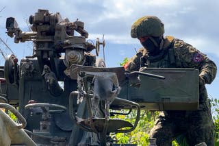 In this photo released by the Russian Defense Ministry press service on Friday, June 21, 2024, a Russian soldier operates a portable anti-aircraft missile at an undisclosed location in Ukraine.