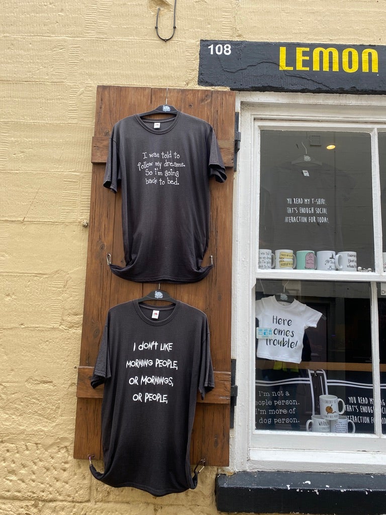 T-shirts hanging in a Whitby shop