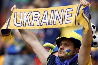 A Ukraine fan attends the UEFA Euro 2024 Group E football match between Slovakia and Ukraine at the Duesseldorf Arena in Duesseldorf